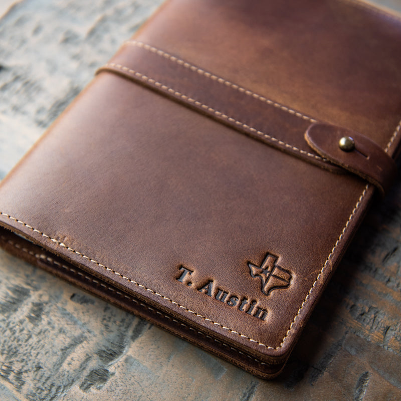 Leather journal cover with personalized name and outline of the state of Texas; from Holtz Leather Co in Huntsville, Alabama